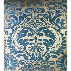 a blue and white wallpaper with an ornate design on it's side,