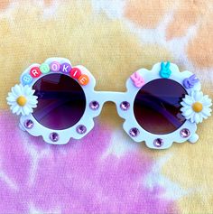 Peace, love and party....These retro scalloped sunnies are oh so stylish. Perfect for the warm weather and all those little ones that love wearing their flower power! Festival Sunglasses With Uv Protection, Festival Sunglasses With Uv Protection And Plastic Frames, Playful Multicolor Sunglasses For Spring, Playful Party Sunglasses With Uv Protection, Fun Multicolor Sunglasses For Spring, Fun Multicolor Spring Sunglasses, Playful Polarized Sunglasses For Spring, Playful Tinted Lens Sunglasses For Festival, Playful Sunglasses For Beach In Spring