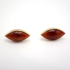 Vintage 14k (.585) yellow gold stud earrings featuring eye outlines, decorated with brown-red color Jade cabochons. These great earrings are 17 mm long and 8 mm wide, weighing a total 3.3 grams. EA3496 Modern Marquise Earrings For Formal Occasions, Modern Cabochon Earrings For Formal Occasions, Formal 14k Gold Brown Jewelry, Formal Brown Jewelry With Polished Finish, Modern Brown Earrings For Formal Occasions, Modern Gold Cabochon Earrings, Modern Amber Earrings For Formal Occasions, Modern Amber Earrings For Formal Events, Eye Outline