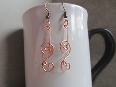 handmade with copper wire Double loop broken note spiral earrings is a gorgeous piece of art the design and idea is similar to my broken note design just with a little more spice Copper and silver will tarnish over time avoid/ limit contact with anything wet or moist like lotions, soaps and never wear it where it can come in contact with water to prolong the shine if tarnish just simply polish the piece with a jewelry polishing cloth I just started this shop so I'm still working out some Kinks so if you have any questions or comments please message me and thank you so much for visiting my shop Swirl Earrings, Spiral Earrings, Notes Design, Polish Jewelry, Statement Jewelry, Earrings Handmade, Swirl, Making Ideas, Favorite Jewelry