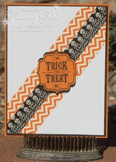 an orange and black trick or treat card