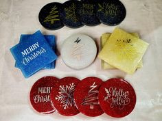 four christmas coasters are sitting next to each other