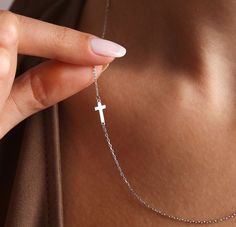 100% 925K Solid Sterling silver 100% Hand Made Adjustable: 2-inch Extension Chain Thickness: 1.1 mm 💖 Embrace the grace of this incredibly delicate and elegant solid silver sideways cross necklace designed for women, offering a sense of protection from the divine. Keep your faith intimately close to your heart with this beautiful cross pendant. This 925 sterling silver cross necklace features a minimalist and delicate gold cross design, making it an ideal Christmas Gift, Mother's Day gift, Valentine's Day Gift, birthday gift for her, a thoughtful gift for granny, children, or a meaningful Graduation Gift. The personalized cross necklace boasts a tiny sideway silver cross charm, making it the perfect gift for Mom. It's an all-silver piece that exudes simplicity and sophistication. 💖 FEATU Dainty Sterling Silver Cross Necklace For Gift, Minimalist White Gold Cross Necklace For Gift, Minimalist White Gold Cross Necklace As Gift, Minimalist White Gold Cross Necklace Gift, Minimalist Silver Cross Necklace For Gift, Minimalist Silver Cross Necklace Gift, Sterling Silver Cross Necklace Gift, Personalized White Gold Cross Necklace, Dainty White Gold Cross Necklace