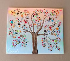 a painting on the wall of a tree with colorful dots