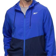 Item: Men’s Reebok Full Zip Training Woven Jacket With Pockets And Drawcord-Adjustable Hood Size: Xl Color: Blue Condition: New With Tag Materials: 100% Polyester Measurements: Approx. 25.5 Inches Across The Chest, & 30 Inches In Length All Items Come From A Smoke Free, Pet Friendly Home. Blue Sportswear Track Jacket For Workout, Moisture-wicking Blue Outerwear For Workout, Blue Moisture-wicking Outerwear For Workout, Blue Sportswear Windbreaker For Gym, Blue Hooded Track Jacket For Gym, Blue Hooded Track Jacket For The Gym, Blue Hooded Moisture-wicking Track Jacket, Blue Sportswear Outerwear For Workout, Sporty Blue Windbreaker For Gym