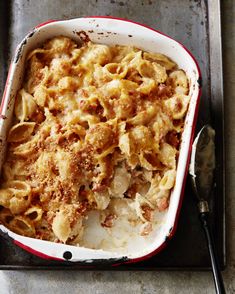 a casserole dish with macaroni and cheese in it on a tray