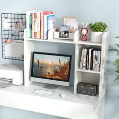 a desktop computer sitting on top of a white desk