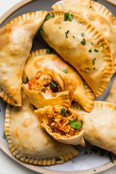 Tender, juicy shredded chicken, onions, peppers and garlic make a hearty, savory filling for our easy chicken empanada recipe. Chicken Empanada Recipe, Chicken Empanada, Baked Empanadas, Chicken Empanadas, Empanadas Dough, Modern Proper, Cooking Chicken To Shred, Meat Pies, Homemade Dough