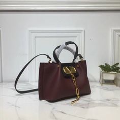 SHOP MORE LUXURY PRODUCTS HERE Description Valentino Small Vlogo Escape Dark Red, For Women, Women’s Bags 16.1in/41cm Size: 41 x 25 x 18 cm /16.1 x 9.8 x 7.1 inches (Width x Height x Length) Made of textured with VLOGO plaqueAdjustable and removable shoulder strapTwo handlesFront detail with magnetic closureFinish hardwareNon-removable front detail Includes dust bag.This product is of the premium quality. Dior Shirt, Gucci Shirt, Louis Vuitton Shirt, Chanel Shirt, Gucci Gg Marmont, Reversible Belt, Luxury Products, Loafer Mules, Mule Sandals