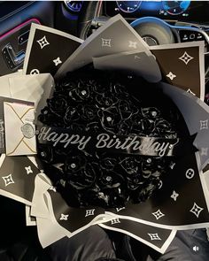 a bunch of stickers sitting on top of a car steering wheel with the words happy birthday written on them