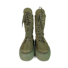 Attico 'Selene' combat boots in green nylon with a lace up closure with green laces, silver grommet and charm hardware, and a green platform sole. Brand = Attico Size = 37EU Condition = 8/10, Very good. Light scratches in nylon toe, some wear to soles. Material = Nylon Hardware = Silver Platform Height = 2" SKU = 19963-32 Trendy Green Boots For Outdoor, Green Leather Combat Boots For Outdoor, Green High-top Lace-up Outdoor Boots, Trendy Green Lace-up Boots, Green High-top Combat Boots For Outdoor, Green High-top Boots With Vibram Sole, Trendy Green Boots With Lug Sole, Green Boots With Rubber Sole For Spring, Green Outdoor Boots With Lug Sole