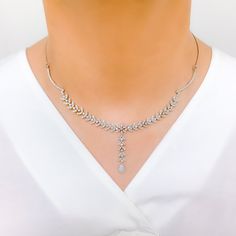 Radiant White Gold Diamond Necklace Set - the perfect addition to any sophisticated ensemble. Crafted from 18k white gold and weighing 24.1 grams, this piece features stunning round diamonds with a total weight of 2.96ct, set in a beautiful 17.5" necklace with a 1.25" drop length. It also comes with matching earrings with a length of 1.25" and screw backs for secure wearing. The lobster lock ensures this set stays safely in place, making it the perfect accessory for any occasion. PRODUCT DETAILS Elegant Sterling Silver Tennis Necklace With Single Cut Diamonds, Elegant Silver Tennis Necklace With Single Cut Diamonds, Silver Platinum Bridal Necklace With Single Cut Diamonds, Silver Bridal Necklace With Single Cut Diamonds In Platinum, Elegant Silver Diamond Tennis Necklace, Elegant White Diamond Tennis Necklace, Dazzling Diamond White Platinum Necklace, Dazzling Platinum Necklace In Diamond White, Exquisite White Gold Hand-set Necklaces