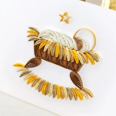 an ornament made to look like a bird with feathers on it's back