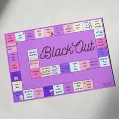 a close up of a board game with the words black out written in cursive writing