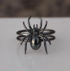 Elevate your Halloween look with our exquisite Spider Halloween Ring. Crafted with intricate detail and luxurious materials, this stunning piece is sure to add a touch of sophistication to any spooky ensemble. Metal :-  Silver Style : Insect Your order will be handmade and ready for shipment in 1 to 3 business days https://www.etsy.com/shop/RivikaDesigns Spider Rings, Insect Ring, Halloween Ring, Oxidized Ring, Spider Halloween, Halloween Spider, Halloween Looks, Silver Style, Gift Handmade