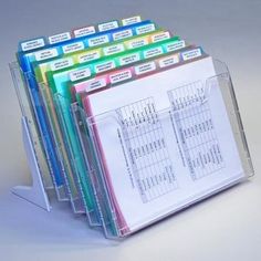 a stack of folders sitting on top of each other in front of a white background