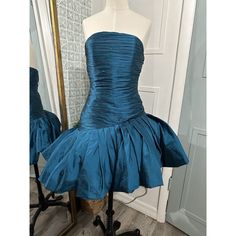 This Stunning Ronny Kobo Party Dress Is Perfect For Any Cocktail Event. The Strapless Neckline And Fringe Accents Add A Touch Of Sophistication To The Beautiful Blue Dress. The Asymmetric Hem And Ruched Details Create A Flattering Fit And Flare Silhouette. In Excellent Condition. No Size Tag, Fits An Xs Flounce Ruffle Hem Bodycon Silhouette Underarm To Underarm Is 16 Inches Laying Flat Waist Is 13 Inches Laying Flat Ronny Kobo, Strapless Neckline, Cocktail Event, Asymmetrical Dress, Asymmetric Hem, Blue Dress, Ruffle Hem, Beautiful Blue, Size Tag