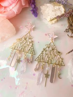 these earrings are fit for a fairy 🧚 though they do feature multiple cute charms, they are super lightweight!  attached to silver plated nickel free earring studs all jewelry in my shop is hand made by myself, so no two pieces will ever be the same. when i restock multiple of a design, keep in mind that things like crystals may vary in shape/size. 💕 Whimsical Sterling Silver Earrings For Party, Whimsical Sterling Silver Party Earrings, Fairycore Jewelry With Matching Earrings For Gift, Whimsical Sterling Silver Dangle Earrings, Cute Earrings With Dangling Charms For Gifts, Nickel-free Fairycore Earrings For Jewelry Making, Gift Crystal Dangle Earrings For Pierced Ears, Fairycore Dangle Earrings With Ear Wire, Fairycore Ear Wire Earrings As Gift