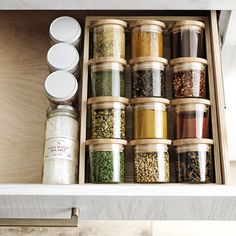 an open drawer filled with lots of spices