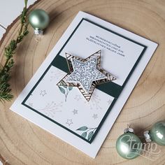 a christmas card with an ornament on it