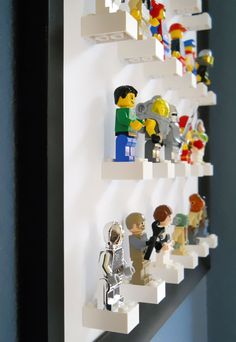 legos are lined up on the wall to form shelves