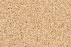 a close up view of the surface of a cork board