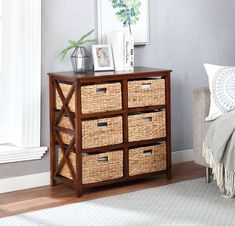 a wooden cabinet with baskets on top of it