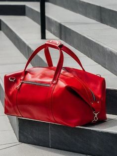 Our leather duffle bags are the perfect weekend bags to carry for both function and style. Large, sustainable and timeless good – bought once and for all! Several meters of genuine red leather turned into a modern travel bag handcrafted individually for you! Short trips or long-term voyages, business assignments and round-the-city walks, there isn’t a situation where this large bag will let you down. Mens Duffel Bag, Weekend Bags, Overnight Travel Bag, Cabin Luggage, Leather Weekender Bag, Leather Weekender, Leather Duffle Bag, Red Bag, Leather Travel Bag