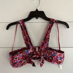 Free People Intimately Bralette Top Size: Small Color: Dark Red With Blue, Pink And Black Floral Pattern Bandeau Style With Straps Tie Front Ruched/Smocked Back Materials Listed In Photos Removed Tags But Never Wore Reasonable Offers Welcome (: Clean, Smoke-Free Home More Info Available Upon Request! Summer Beach Bra With Floral Print, Summer Bra Friendly Red Halter Top, Summer Red Halter Top, Bra Friendly, Red Summer Bra, Floral Print Underwire Bra For Beach, Red Bandeau Halter Top, Floral Print Underwire Bra, Bandeau Tops With Straps For Beach, Black Floral Pattern