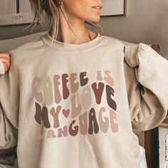 We get it, coffee is our love language too. It just seems to make everything a little bit better ~ just like our cozy, oversized coffee sweatshirt does. PRODUCT FEATURES Ideal for any situation, a unisex heavy blend crewneck sweatshirt is pure comfort. These garments are made from polyester and cotton. This combination helps designs come out looking fresh and beautiful. The collar is ribbed knit, so it retains its shape even after washing. There are no itchy side seams on these sweaters.  .: Made with a medium-heavy fabric blend of 50% cotton and 50% polyester (8.0 oz/yd² (271.25 g/m this sweatshirt feels cozy and is the perfect choice for those colder months. .: The classic fit along with the crew neckline deliver a comfy wearing experience with a clean-cut style. Meanwhile, the double-ne Coffee Is My Love Language, Coffee Product, Coffee Sweater, My Love Language, Coffee Sweatshirt, Coffee Lover Gift, Hippie Vibes, Mini Succulents, Love Language