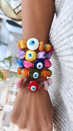 Trendy Handmade Evil Eye Bracelet With Round Beads, Handmade Colorful Beaded Bracelets For Vacation, Trendy Evil Eye Bracelet For Festivals, Trendy Evil Eye Beaded Bracelets For Festivals, Bohemian Beaded Bracelets With Evil Eye For Summer, Evil Eye Bracelet With Round Beads For Beach, Fun Handmade Bracelets For Vacation, Trendy Evil Eye Jewelry For Festivals, Resizable Multicolor Evil Eye Bracelet For Friendship