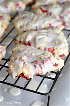 strawberry scones cooling on a rack with icing