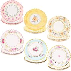 six plates with different designs on them, one is yellow and the other has pink flowers