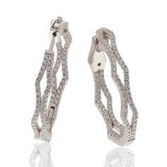 These dazzling and radiant Suzy Levian sterling silver cubic zirconia hoop earrings will add sparkling sophistication to your ensemble. These earrings feature sparkling white pave-set cubic zirconia on the inside and outside of the hoops. The wavy designs of two pave wavy bands coming together and moving apart create a modern take on a clasic look. These designer Suzy Levian earrings come in sterling silver or rosed sterling silver to make the perfect match for the look you're wishing for. Pave Hoop Earrings, Modern Hoop Earrings, Gemstone Brooch, Cubic Zirconia Hoop Earrings, Cubic Zirconia Bracelet, Cubic Zirconia Necklace, Cubic Zirconia Jewelry, Cubic Zirconia Earrings, Cubic Zirconia Rings