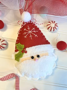 a santa clause ornament hanging on a wall