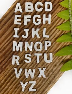 the letters and numbers are cut out of wood