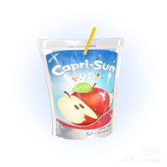 a plastic cup filled with an apple and a straw sticking out of it's side