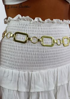 We are obsessed with this gold rectangular ring chain belt! It is the perfect piece to spice up any outfit. Pair it with a pair of jeans or a skirt for the ultimate cutest outfit. We know you will rock it! Model Info Meet Karlie! These are all one size. Hips: 37” | Waist: 25” | Bust: 34” | Height: 5’7” The Details EXCHANGE ONLY ITEM: No Returns Large Rectangular Ring Chain Belt Total Length: 40" Trendy Gold Belts For Spring, Chain Belt With Chain Strap For Summer Festivals, Trendy Gold Chain Belt For Night Out, Chic Gold Chain Belt For Spring, Chic Gold Belt For Summer, Gold Chain Belt For Party In Spring, Gold Belt For Party Occasions In Spring, Trendy Gold Party Belt, Chic Metal Chain Belt For Summer