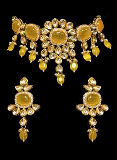 Nayana - Modern Bride Kundan Bridal Set with Yellow Onyx stone Indian bridal set makes every bride's outfit perfect. This clear Kundan is further accented with yellow Onyx gems making it one of a kind. Beautiful gemstone drops adorn this set. This jewelry set is sure to make you stand out from the crowd. This necklace set comes along with a beautiful pair of Jhumka earrings with Kundan and Yellow Onyx to match. Our Bridal collection is handmade with love & care. It makes us super happy to be Festival Kundan Yellow Gold Jewelry, Yellow Gold Kundan Jewelry With Stone Setting, Bollywood Kundan Yellow Set, Elegant Yellow Kundan Jewelry, Bridal Look Indian, Traditional Kundan Dual-tone Jewelry Sets, Kundan Bridal Set, Bridal Jewellery Indian, Jhumka Earrings