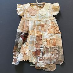 a dress made out of old newspaper pieces