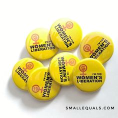 six women's liberation button badges on a white background with the words women's liberation printed on them