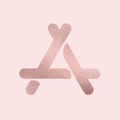 a pink wallpaper with the letter k in it's center and an arrow on top