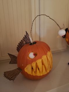 a carved pumpkin with an angry face and mouth