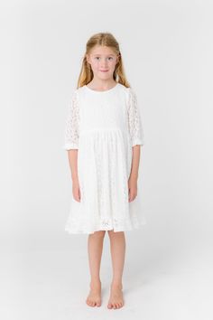 All over lace girl's dress 1/2 length sleeves Round neckline Gathered waist Button back closure Fabric content - Cotton - Dry clean only Lace Short Sleeve First Communion Dress, First Communion Dress With Scalloped Lace, Summer First Communion Dress With Lace Trim, First Communion Cotton Dress With Lace Trim, First Communion Dress With Lace Bodice, Tulle, Getaway Dress, Girls Lace Dress, Occasion Dresses Wedding, Cream Dress