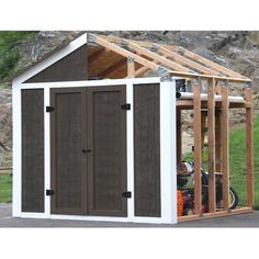 an outdoor storage shed with the door open