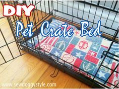 a dog bed that is on the floor in front of a cage with words diy pet crate bed