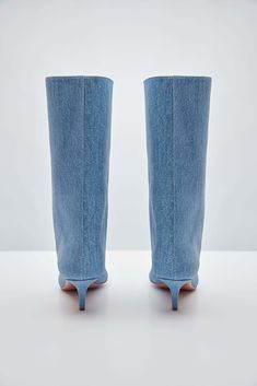 For Spring/Summer 2024, Amina Muaddi played with the idea of trompe l'œil by crafting a pair of thigh-high suede boots with a denim print. Spring Denim Knee-high Boots, Spring Knee-high Denim Boots, Denim Knee-high Boots For Spring, Fitted Denim Boots With Pointed Toe, Fitted Denim Boots For Spring, Denim Summer Boots, Chic Denim Blue Boots For Spring, Fitted Denim Knee-high Boots, Fitted Denim Summer Boots