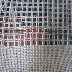 a piece of cloth with red stitching on it