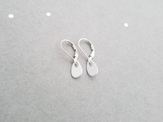 "These sterling silver earrings are a perfect match for any necklace, and are great for every day wear! An ultra shiny 7x10mm sterling silver teardrop hangs from sterling silver leverback or french earwires. The total length of these earrings is aprox 1\". These earrings will arrive in a small zip lock bag, as well as a decorative organza bag. It is recommended that the earrings are kept in the bag when not being worn to keep them nice and shiny. Of course, a quick polish will always work too :- Sterling Silver Teardrop Earrings With Lever Back For Gifts, Gift Sterling Silver Teardrop Earrings With Lever Back, Teardrop Earrings With Lever Back Ear Wires, Minimalist Teardrop Jewelry With Lever Back Ear Wires, Silver Dainty Earrings With French Hook, Dainty Silver Teardrop Earrings In Sterling Silver, Dainty Silver Sterling Silver Teardrop Earrings, Sterling Silver Teardrop Earrings With Lever Back, Nickel-free Minimalist Sterling Silver Teardrop Earrings