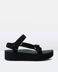 The Flatform by Teva is a platform sandal in a black colour way. This style features a durable polyester webbing upper that dries quickly after getting wet, a hook-and-loop closure that is easy to use and wear as well as a lightweight platform heel and rubber outsole for traction.Teva shoes are displayed in US WOMEN'S SIZES. Teva Flatform, I Have Money, Teen Shopping, Swim Trends, Flatform Sandals, Women Flats, Women Sandals, Fashion Fits, Water Shoes